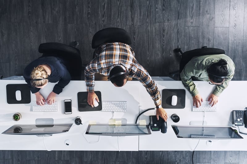 top down shot of team working at their desks