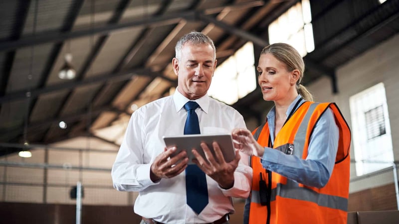 man and woman in warehouse