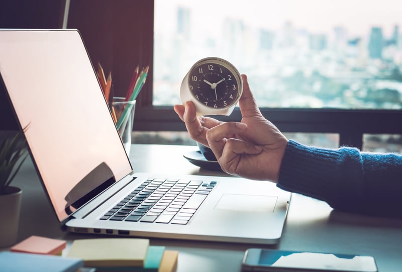looking at clock on work desk