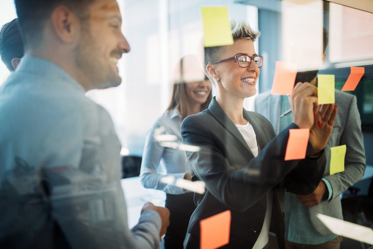 Business people planning strategy in modern office together