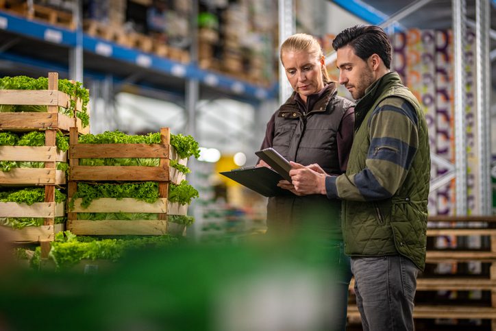 workers checking grocery shipment