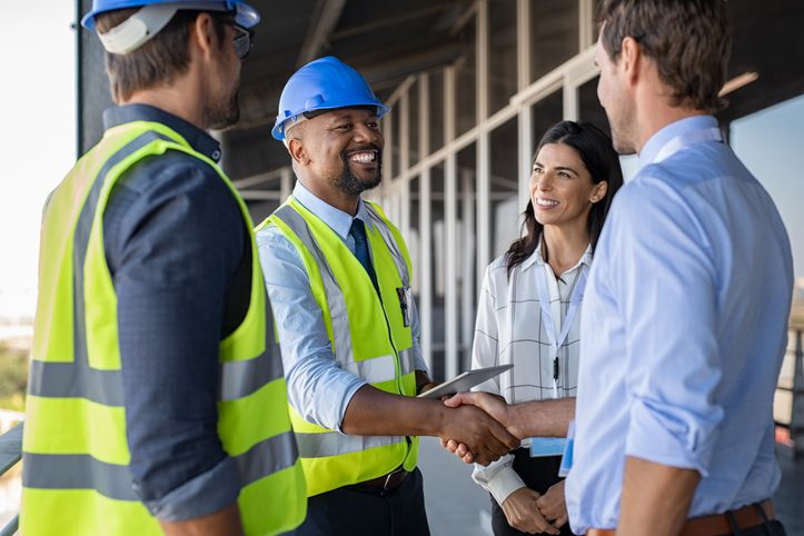 colleagues having discussion warehouse workers