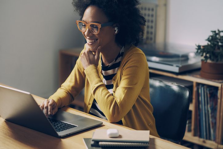 smiling businesswoman on laptop