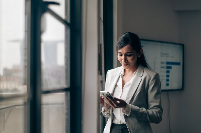 businesswoman looking at her phone