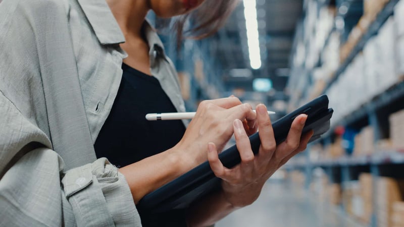 woman managing warehouse