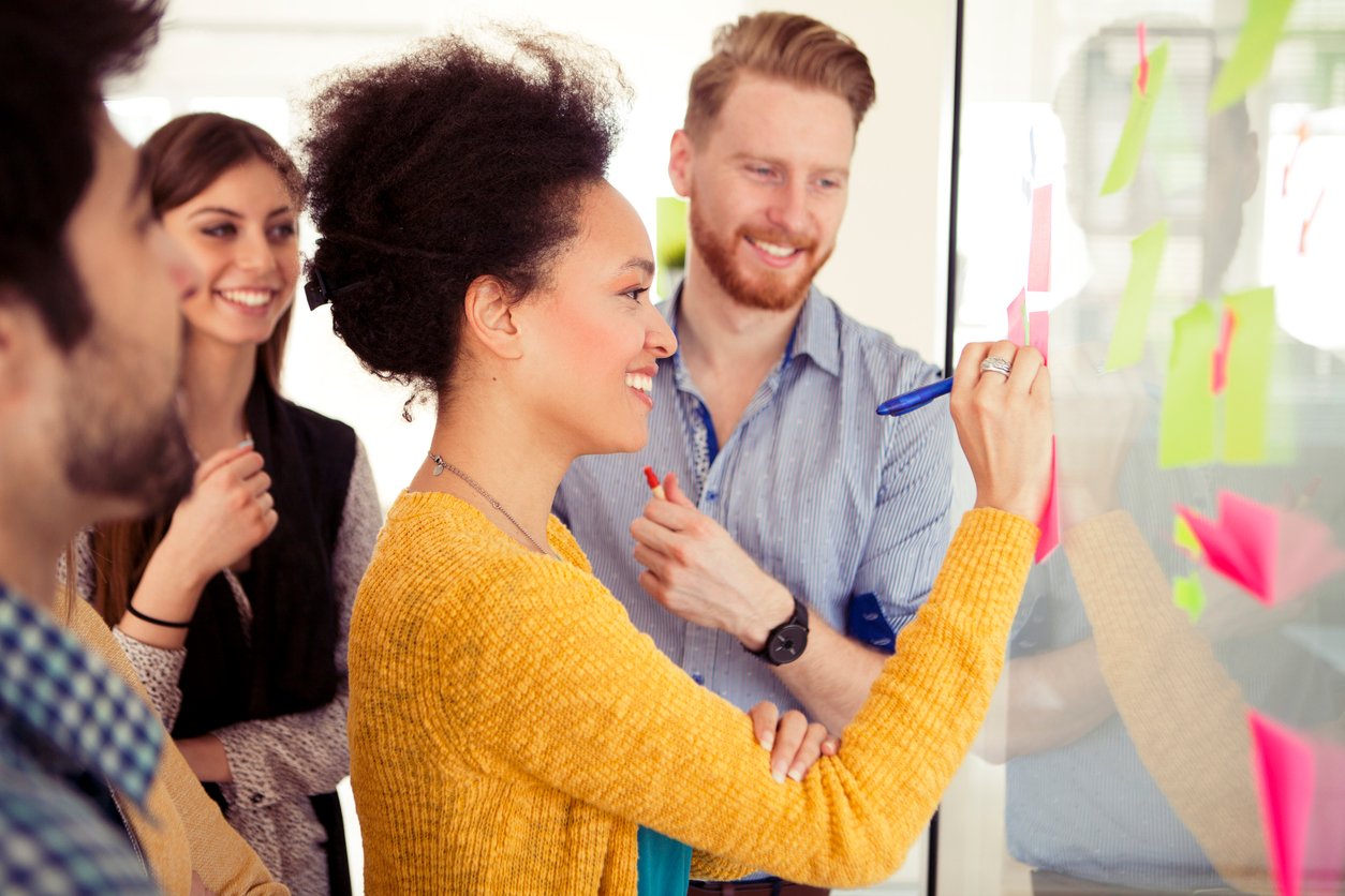 Group of young creative people collaborating in modern office.