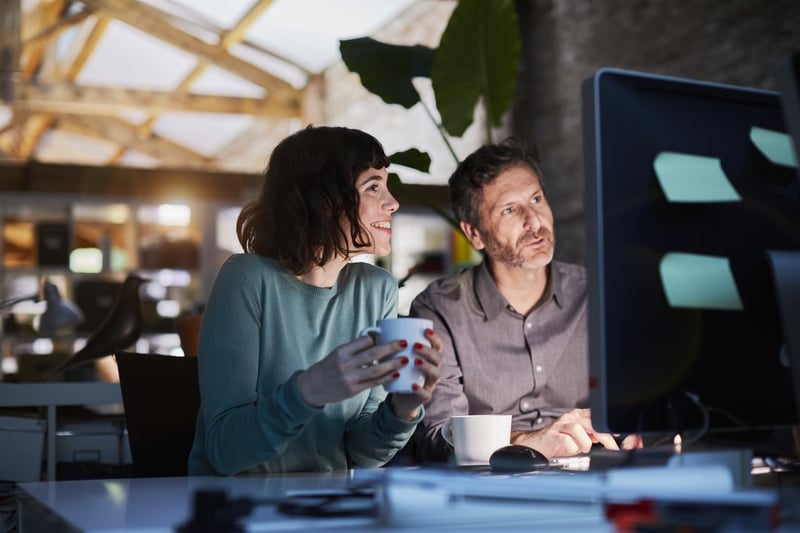 colleagues working late in a small office