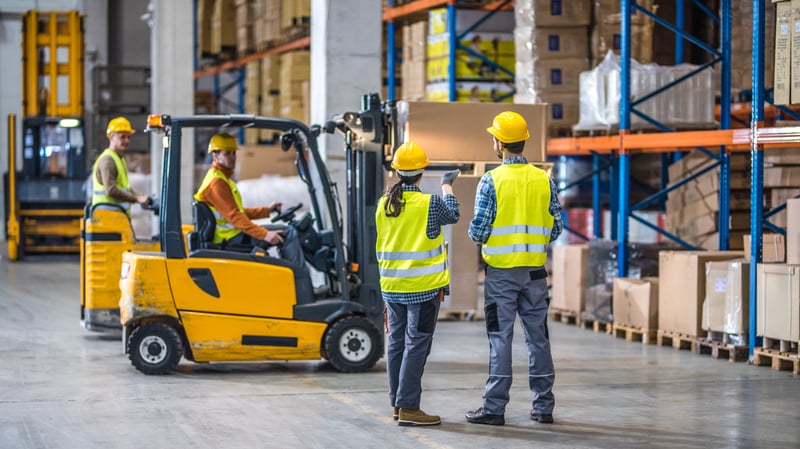 warehouse workers talking