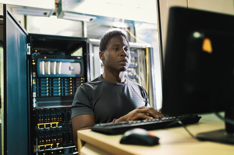 IT engineer looking at his monitor