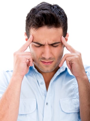 Man with a headache - isolated over a white background
